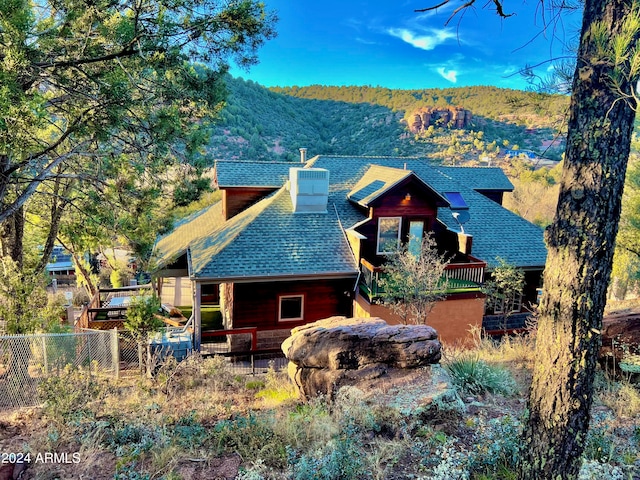 back of house featuring a mountain view