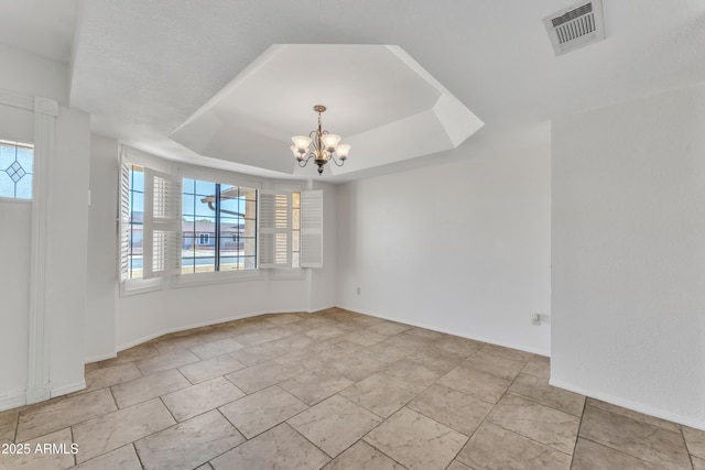 3046 E Dover St, Mesa, AZ 85213 - spare room with a chandelier and a raised ceiling