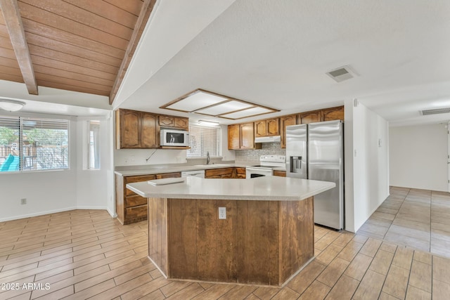 3046 E Dover St, Mesa, AZ 85213 - kitchen featuring white appliances, under cabinet range hood, light wood-style floors, light countertops, and wooden ceiling