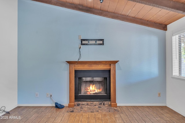 3046 E Dover St, Mesa, AZ 85213 - detailed view of wood finished floors, a warm lit fireplace, and a wood ceiling with exposed beams
