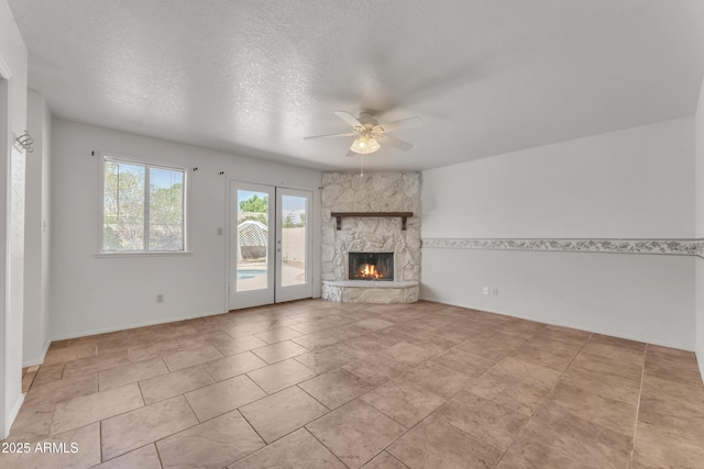 3046 E Dover St, Mesa, AZ 85213 - unfurnished living room with ceiling fan, a fireplace, and a textured ceiling
