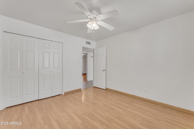 3046 E Dover St, Mesa, AZ 85213 - unfurnished bedroom with light wood finished floors, a closet, and a ceiling fan