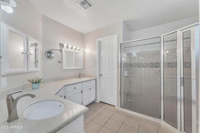 3046 E Dover St, Mesa, AZ 85213 - bathroom featuring a shower stall, double vanity, and tile patterned floors