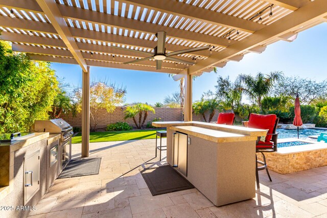 view of patio / terrace with exterior kitchen, a fenced backyard, a pergola, outdoor dry bar, and a grill