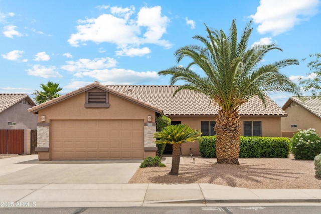 10341 E Dragoon Ave, Mesa, AZ 85208 - view of front of property with stucco siding, concrete driveway, an attached garage, and a tiled roof
