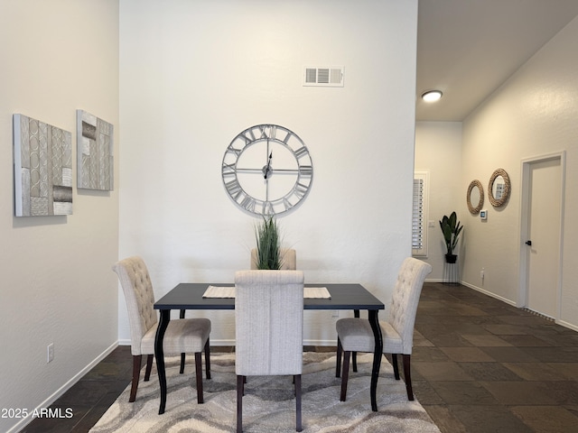 10341 E Dragoon Ave, Mesa, AZ 85208 - dining area with baseboards and stone tile flooring