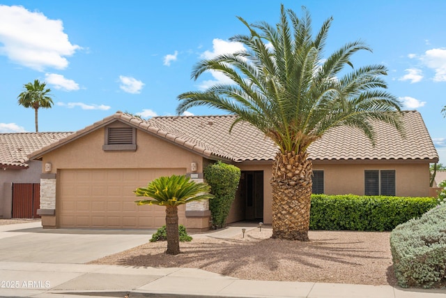 10341 E Dragoon Ave, Mesa, AZ 85208 - view of front facade featuring stucco siding, concrete driveway, an attached garage, and a tiled roof