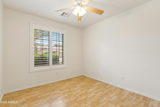 10341 E Dragoon Ave, Mesa, AZ 85208 - empty room with wood finished floors and a ceiling fan