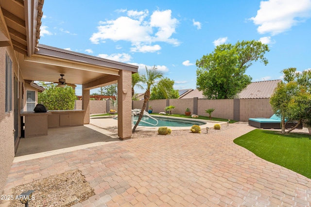 10341 E Dragoon Ave, Mesa, AZ 85208 - fenced backyard with a ceiling fan and a patio