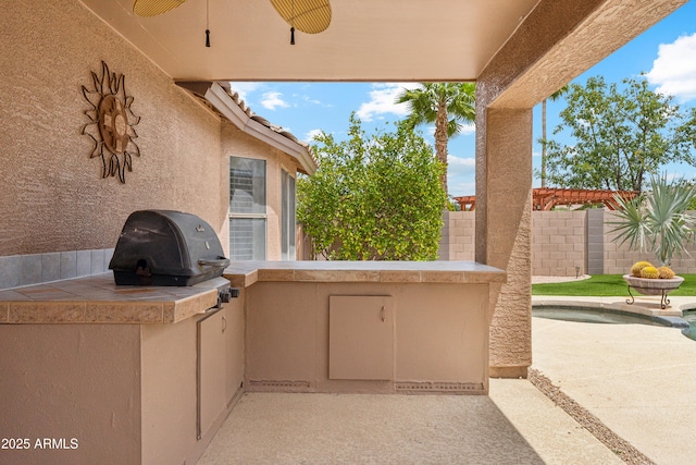 10341 E Dragoon Ave, Mesa, AZ 85208 - view of patio with exterior kitchen and a ceiling fan