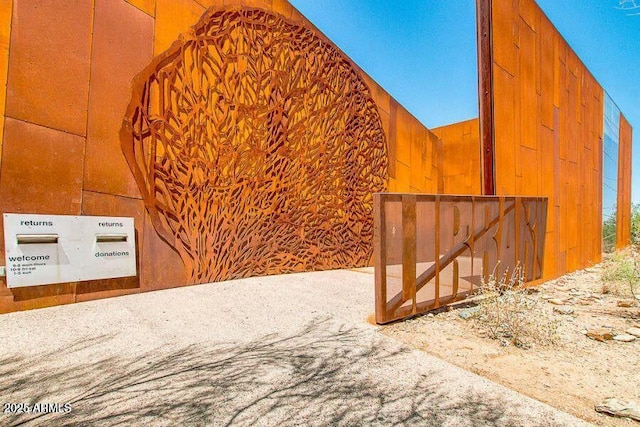 exterior space with vaulted ceiling and wood walls