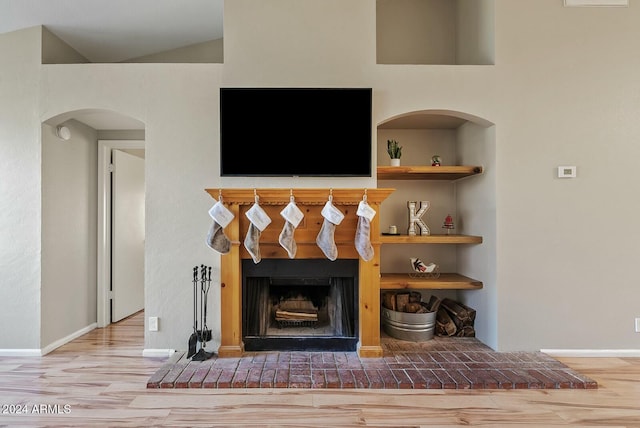 interior details with hardwood / wood-style flooring and built in features