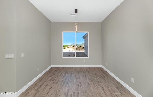 unfurnished dining area with light hardwood / wood-style floors