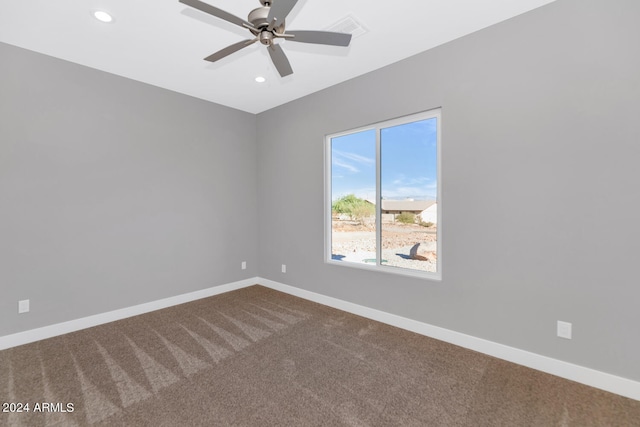 unfurnished room with carpet and ceiling fan