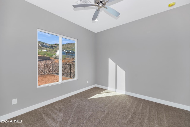 unfurnished room featuring carpet floors and ceiling fan