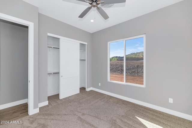 unfurnished bedroom featuring carpet and ceiling fan