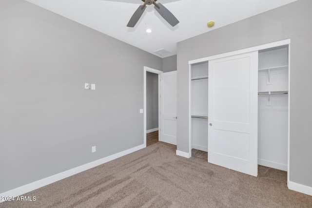 unfurnished bedroom featuring carpet flooring, a closet, and ceiling fan