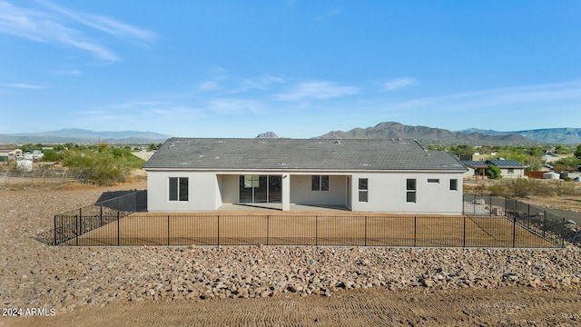 back of house featuring a mountain view