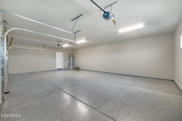 garage featuring a garage door opener and water heater