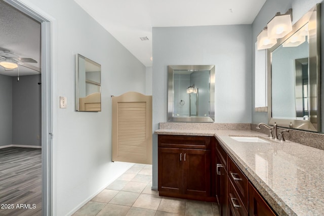 12811 N 44th Dr, Glendale, AZ 85304 - bathroom with ceiling fan, vanity, baseboards, and tile patterned flooring