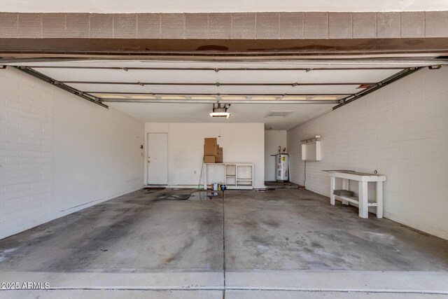 12811 N 44th Dr, Glendale, AZ 85304 - garage with a garage door opener and electric water heater