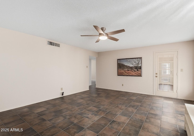 12811 N 44th Dr, Glendale, AZ 85304 - empty room with ceiling fan and a textured ceiling
