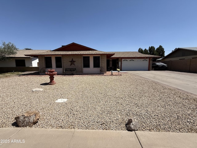 1557 W Posada Ave, Mesa, AZ 85202 - ranch-style house featuring a garage, concrete driveway, and brick siding