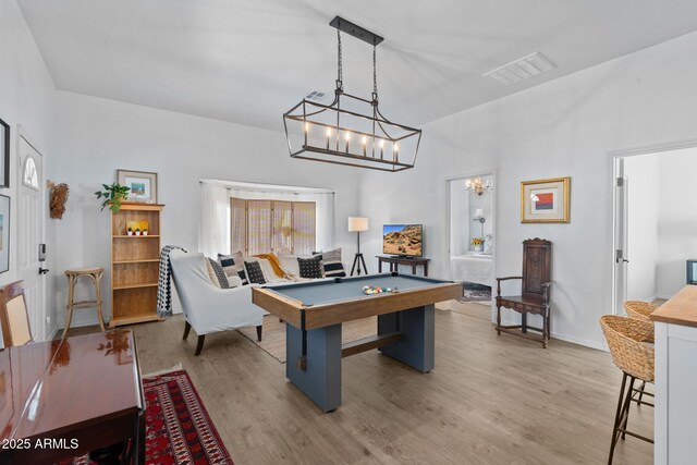 31032 N 66th St, Cave Creek, AZ 85331 - playroom with a chandelier, light wood-style floors, and baseboards