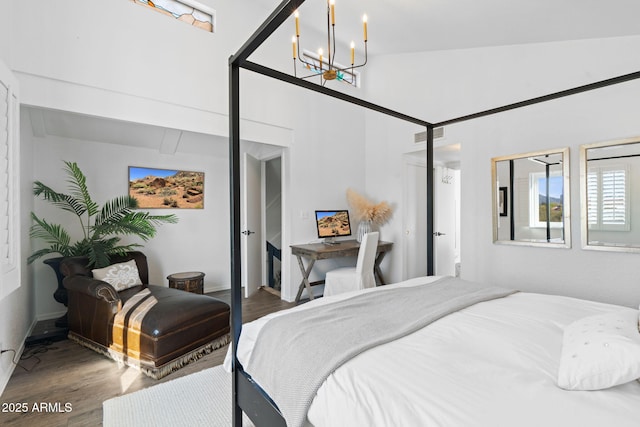 31032 N 66th St, Cave Creek, AZ 85331 - bedroom featuring wood finished floors, a chandelier, and a high ceiling