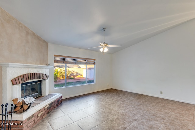 unfurnished living room featuring light tile patterned floors, ceiling fan, and a brick fireplace