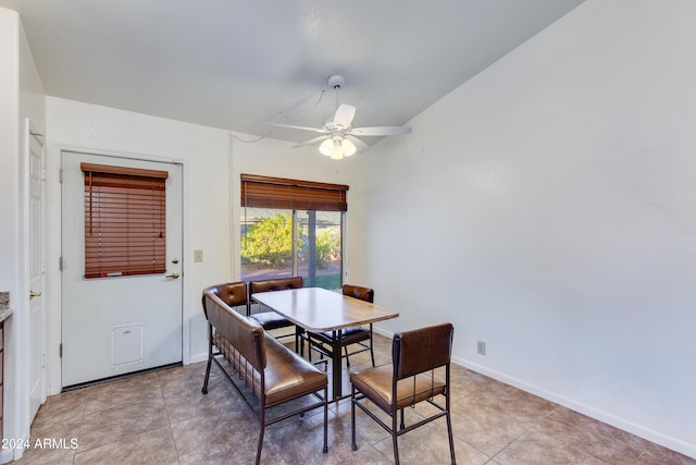 dining room featuring ceiling fan and light tile patterned flooring