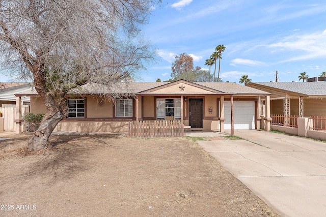 5137 N 20th Ave, Phoenix, AZ 85015 - single story home with a garage, stucco siding, driveway, and fence