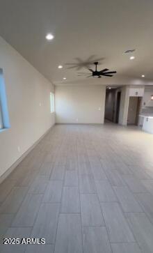 unfurnished living room with a ceiling fan and recessed lighting