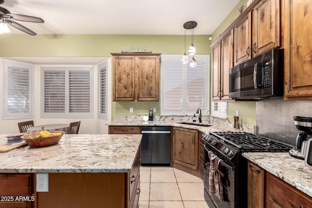 kitchen with a ceiling fan, decorative light fixtures, a sink, black appliances, and light tile patterned flooring