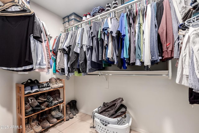 spacious closet featuring tile patterned floors