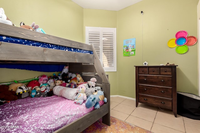 tiled bedroom with baseboards