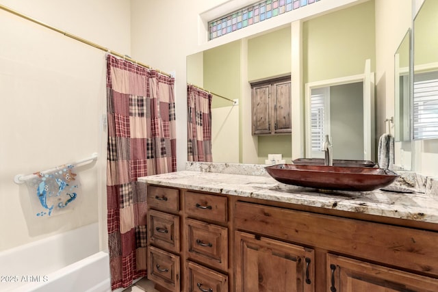 bathroom with vanity and shower / bath combo with shower curtain