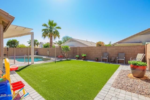 view of yard with a patio, a fenced backyard, and a fenced in pool