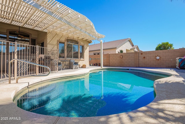 view of swimming pool with a fenced backyard, a fenced in pool, ceiling fan, and a patio