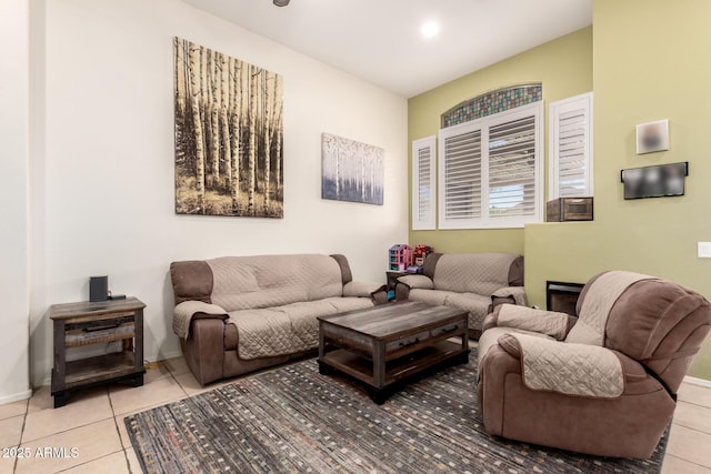 living area with tile patterned floors and baseboards