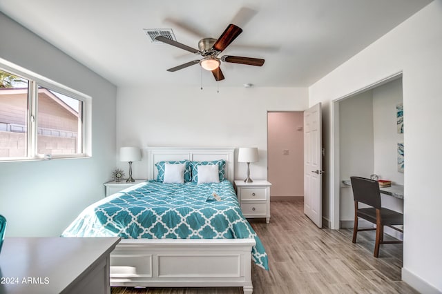 bedroom with light wood-type flooring and ceiling fan