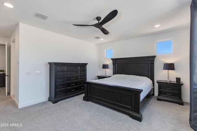 bedroom with light carpet and ceiling fan