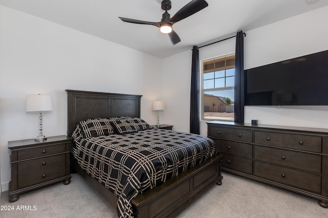 bedroom with ceiling fan and light colored carpet