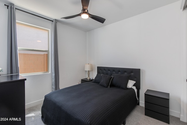 carpeted bedroom featuring ceiling fan