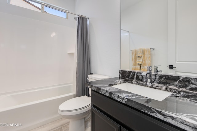 full bathroom with vanity, toilet, and shower / tub combo with curtain