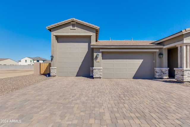 single story home featuring a garage