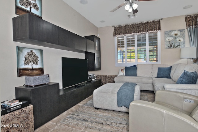 living area featuring visible vents, light tile patterned floors, and a ceiling fan