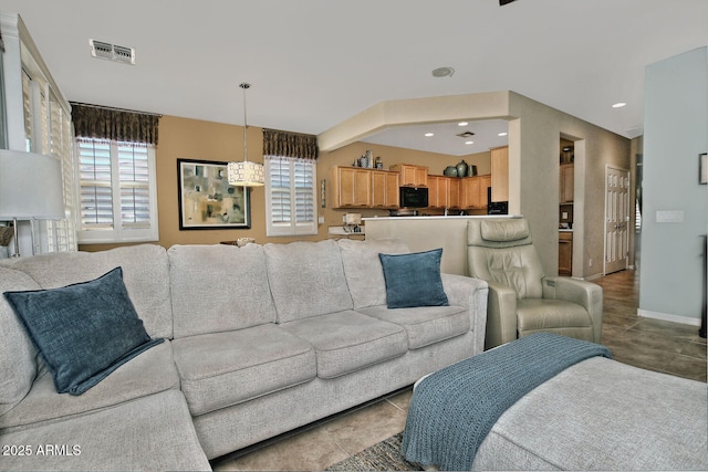 living area featuring baseboards, recessed lighting, visible vents, and tile patterned floors