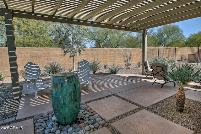 view of patio featuring a fenced backyard and a pergola