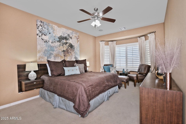 bedroom featuring a ceiling fan, carpet flooring, visible vents, and baseboards